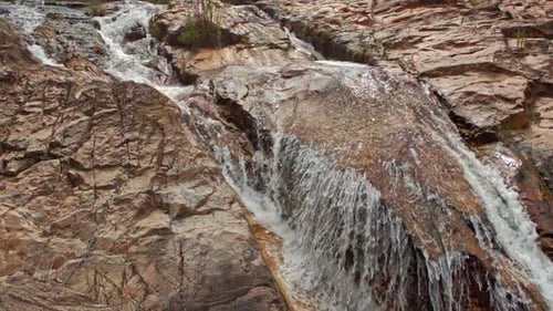 Foamy Mountain Stream Cascade Washes Brown Rocks