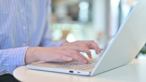 Close Up of Female Hands Typing on Laptop