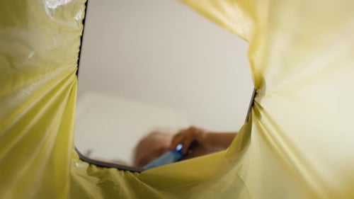 Video of girl throws plastic bottles in the garbage. Shot with RED helium camera in 8K