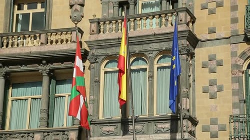 Flags Waving Outside European Ornate Building