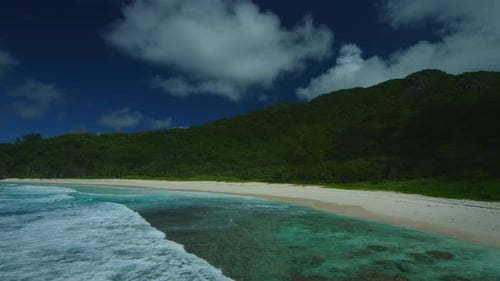 Waves and Deserted Sandy Beach