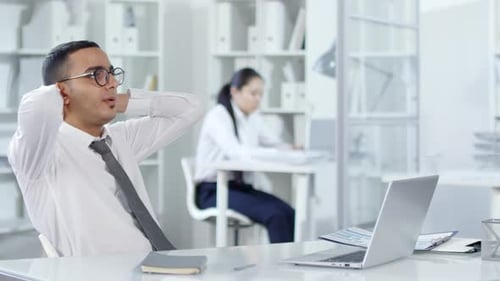 Arab Man Discussing Invisible AR Projection on Video Call in Office