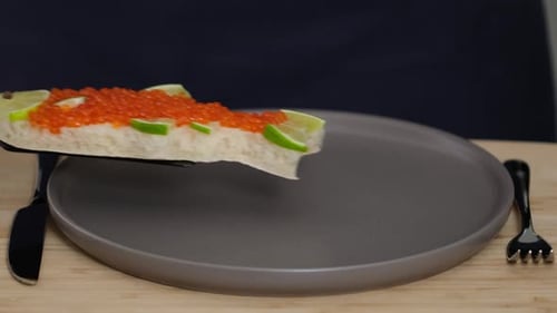 Red Roe Fish Canape Being Placed on Plate