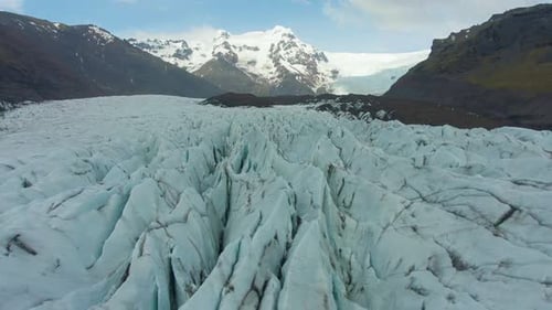 Svinafellsjokull Glacier. Ash and Cracks. Iceland. Aerial View