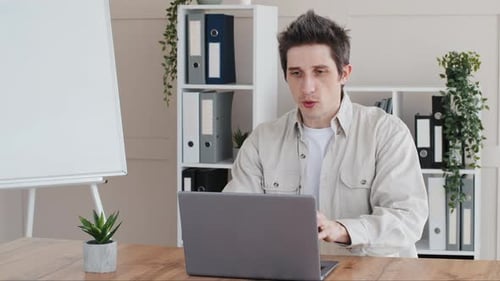Millennial Business Man Guy Freelance Worker User Designer Working in Office Sitting at Table with