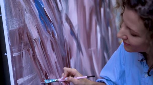 Woman Painting Abstract Artwork on Canvas