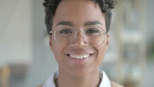 Woman Smiling Directly to Camera in Close Up