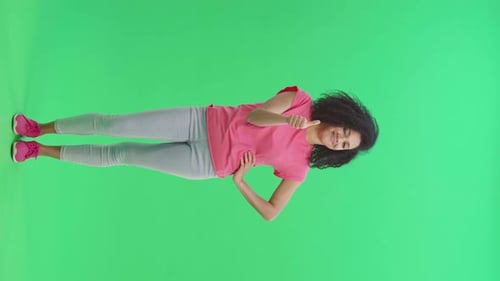 Enthusiastic Woman Gives Thumbs Up on Green Screen
