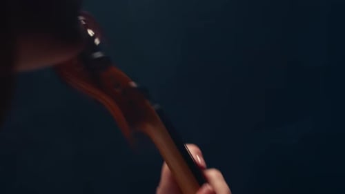 Violin Player Close Up with Dark Background