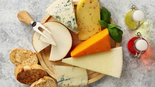 Overhead shot of cheese and bread on board