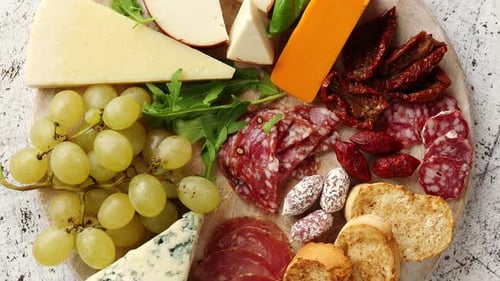 Delicious Cheese, Meat, and Grapes Charcuterie Board