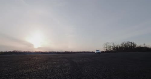 Car Drifting at Twilight in Countryside