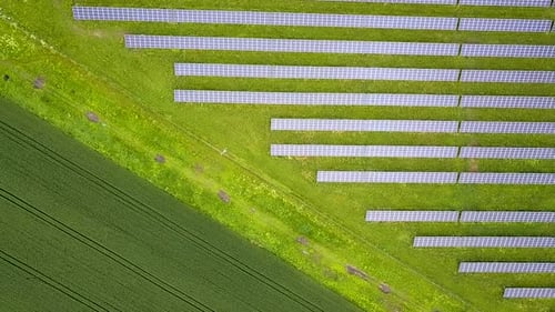 Aerial view of solar power plant field. Electrical photovoltaic panels for producing clean ecologic