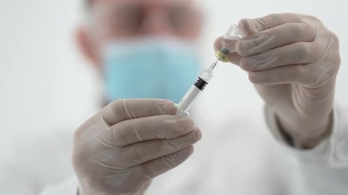 Medical Professional Preparing a Vaccine Dose