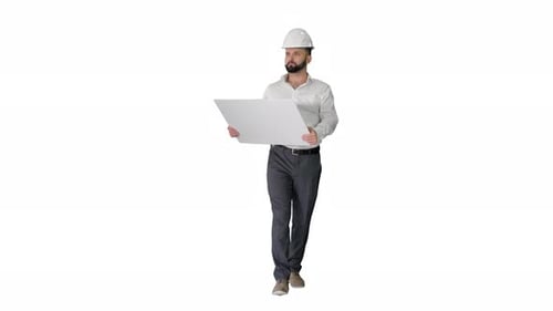 Man in Hard Hat Walking with Blueprint