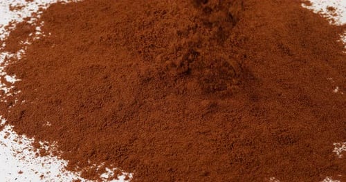 Coffee Powder Pile on White Surface Close Up