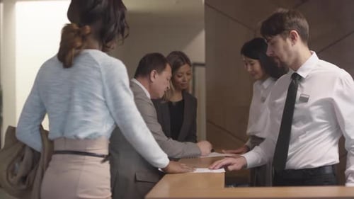 Hotel Receptionists Working with Guests