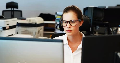 Businesswoman Working on Computer in Office