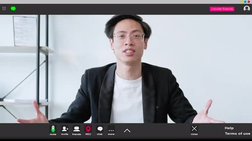 Man Video Conferencing in Home Office Setting