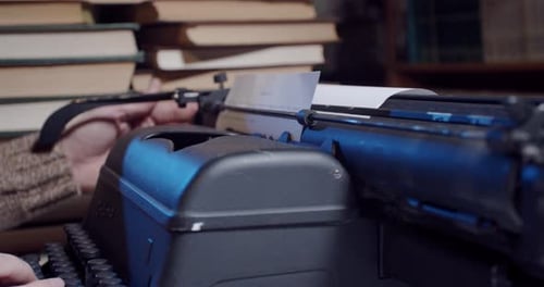 Vintage typewriter at work, typing text on a sheet of paper, 4k