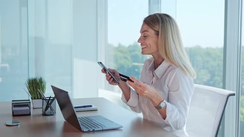 Woman With Credit Card, Laptop at Desk