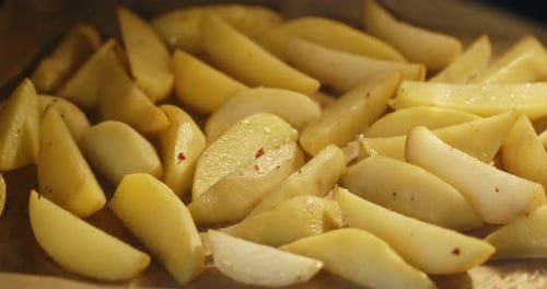 Timelapse Potatoes with Spices Baked in Oven.