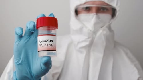 Medical Professional Holding Covid-19 Vaccine Vial