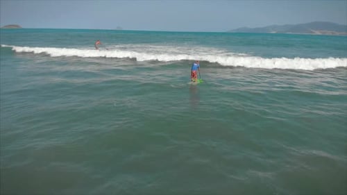 Paddleboarding on Aqua Ocean Waters on Bright Day