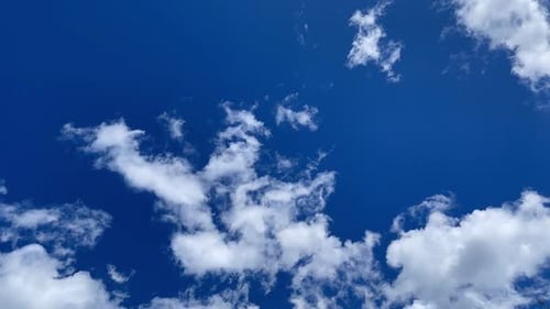 Bright Blue Sky with Fluffy White Clouds