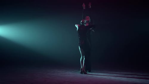 Couple Performing Latin Dance on Stage