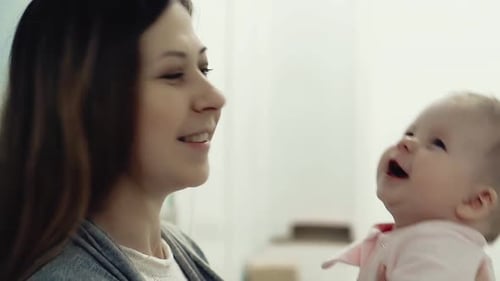 Woman and Baby Smiling Together