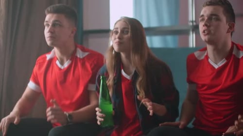 Excited Young Adults Cheer While Watching Sports