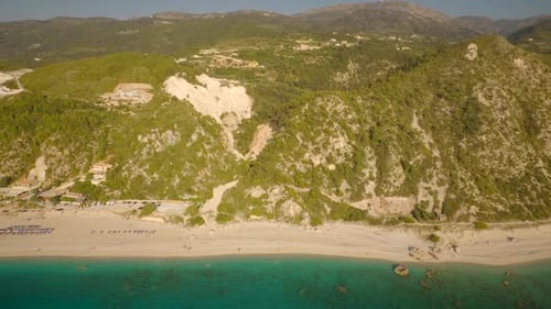 Aerial view of beautiful beach, with small hills behind in Lefkas island.