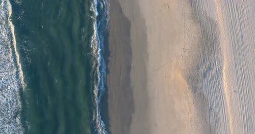 Aerial View of Waves on a Sandy Beach