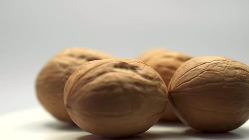 Brown Walnuts Panning Close Up View