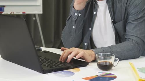 Cropped Shot of a Mature Businessman Talking on the Phone at the Office