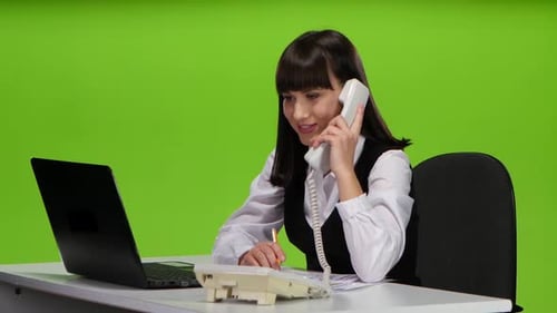 Girl Administrator Cute Answers the Phone Call. Green Screen