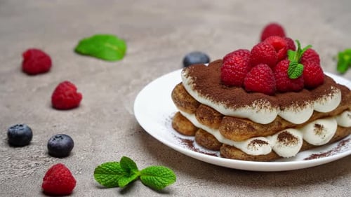Delicious Cake with Berries and Mint Garnish