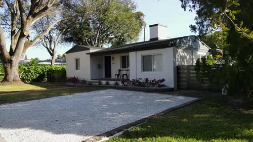 Charming Suburban Home with Manicured Lawn and Garden