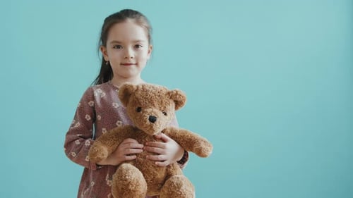 Adorable Little Girl with Plush Toy