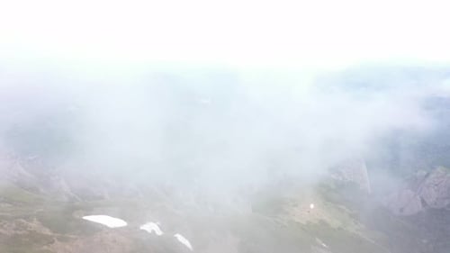 Ffy Through The Clouds Over The Mountains