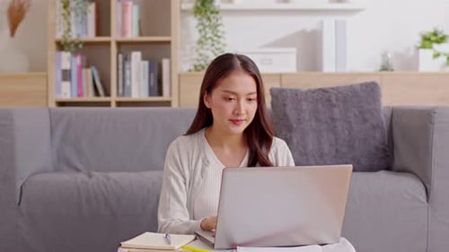 Asian Businesswoman finish work close computer laptop in workplace and looking at camera smile with