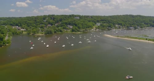 Flying Towards Boats Anchored on Harbor and Aerial View of Houses Amongst Trees