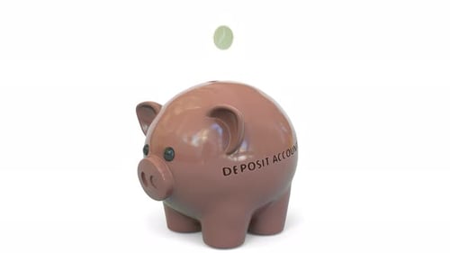 El dinero cae en una alcancía con el texto de la cuenta de depósito