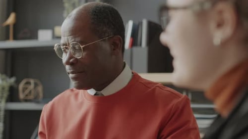 Man Talking in Office with a Coworker