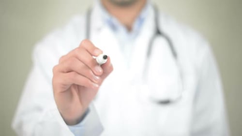 Doctor Writes the Word Life with Marker