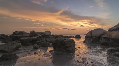 Timelapse magnificent sunset near rock stone
