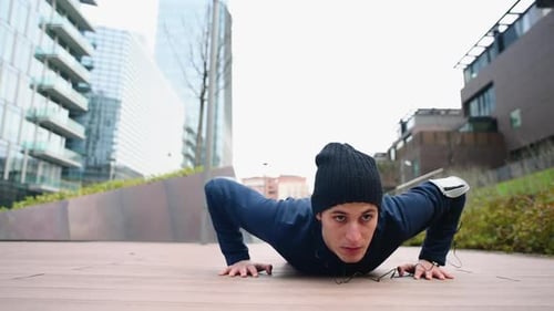 Man Doing Pushups in an Urban Setting