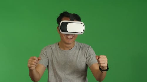 Man Driving in VR Headset, Green Screen