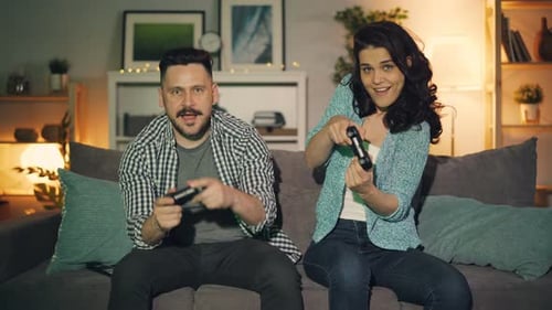 Couple Playing Video Games Together on Couch